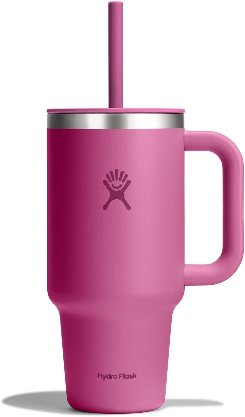 Pink Hydro Flask cup with straw on a minimalist desk, ADHD hyperfocus management hydration tool