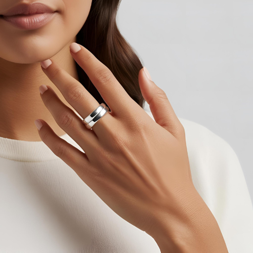 Woman wearing a discreet silver spinner fidget ring for ADHD focus